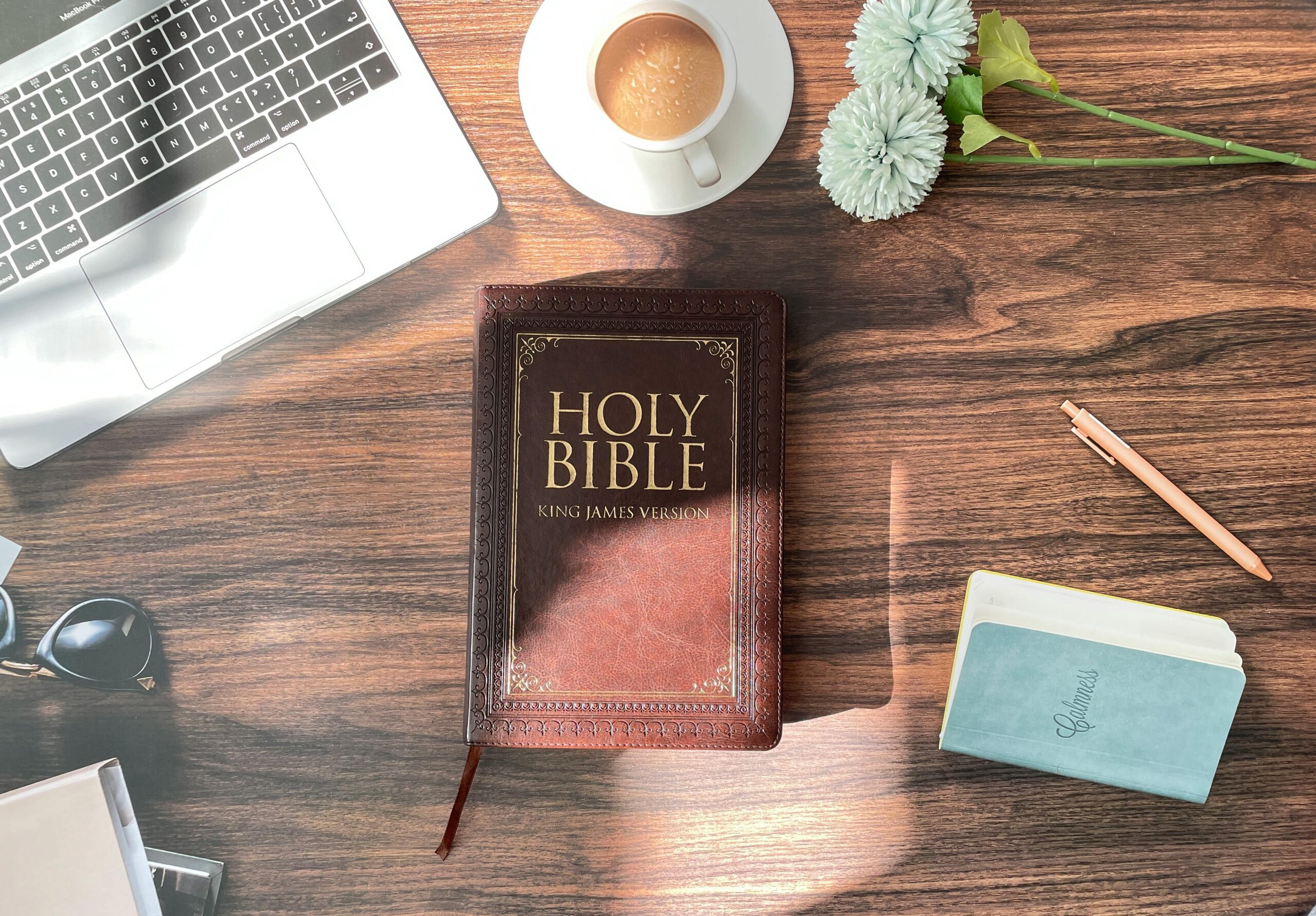Bible and prayer journal on a table during personal reflection