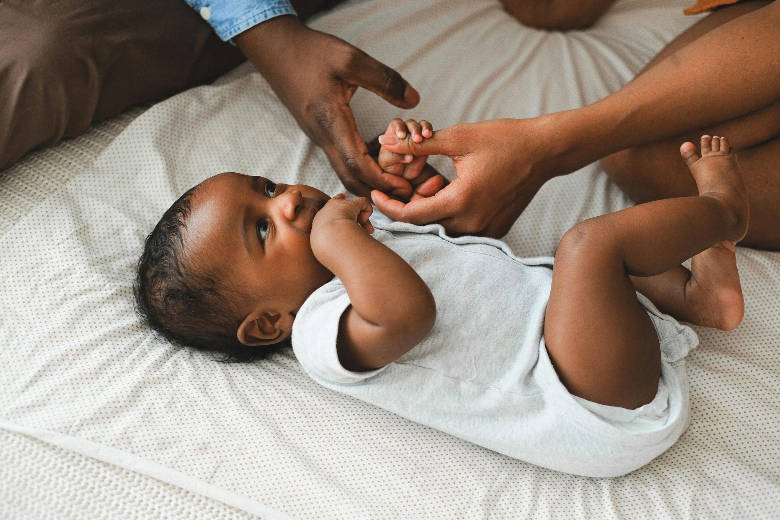 A mother and toddler holding hands in a moment that reflects intentional living for tired moms.